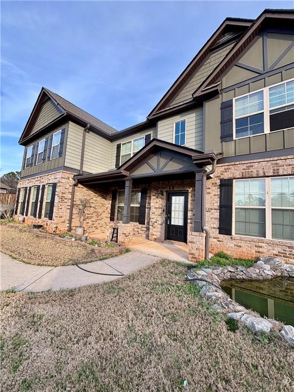 328 Vantage Point Locust Grove, GA 30248 - Photo 2 of 33 a front view of a house with garden