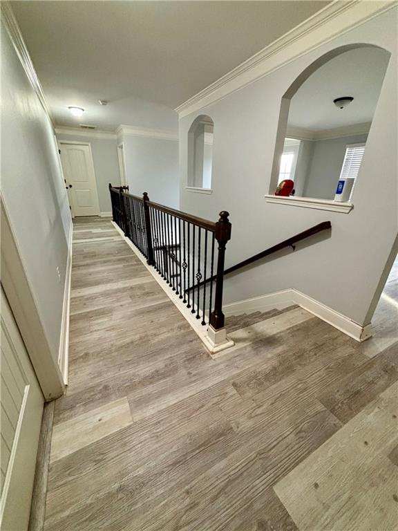 328 Vantage Point Locust Grove, GA 30248 - Photo 23 of 33 a view of a hallway with wooden floor and stairs