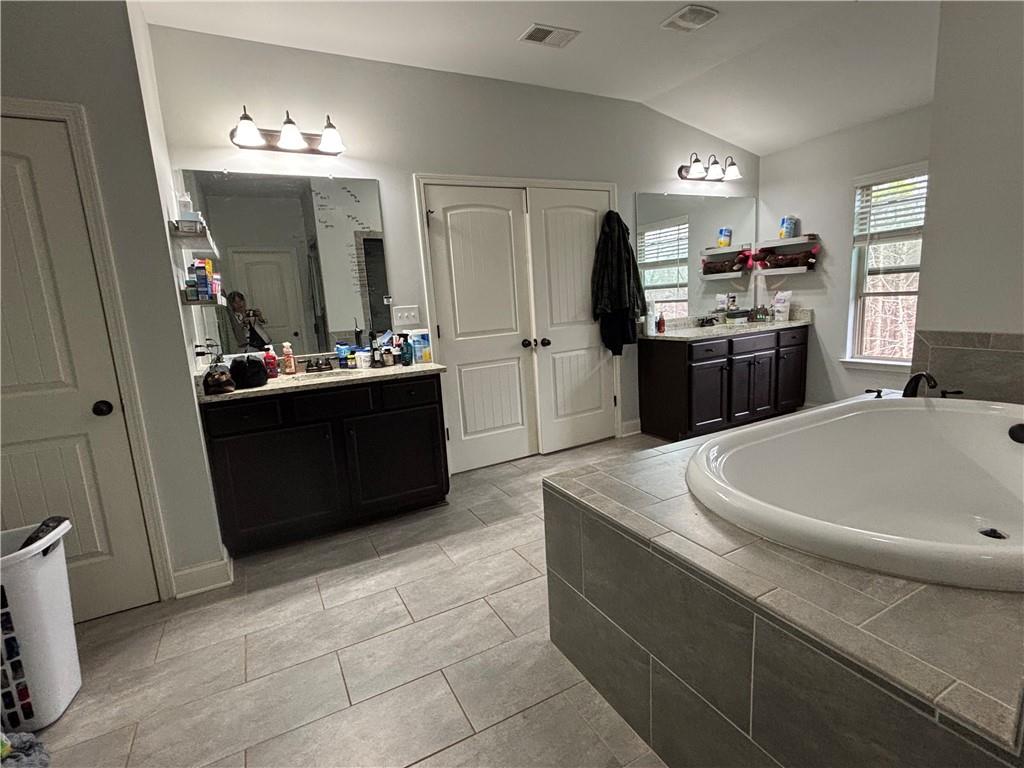 328 Vantage Point Locust Grove, GA 30248 - Photo 25 of 33 a kitchen with stainless steel appliances a sink stove and refrigerator