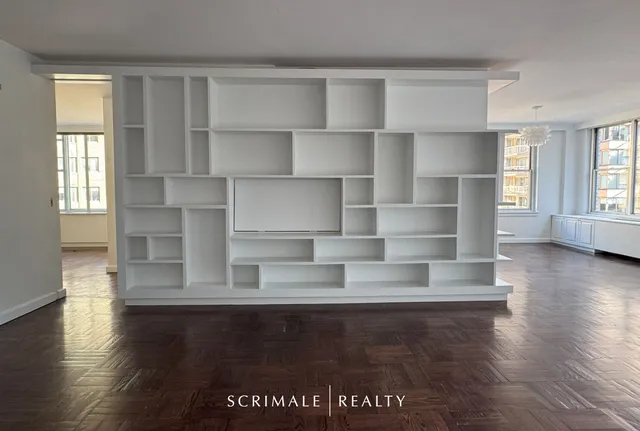 a kitchen with stainless steel appliances granite countertop a refrigerator and a stove