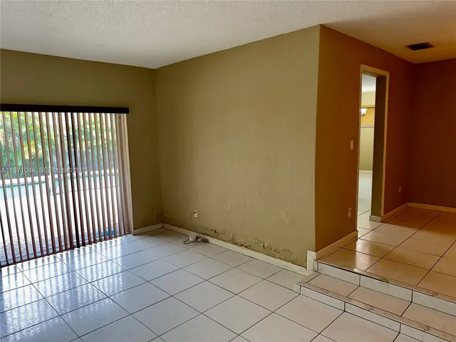 a view of a room with a large window