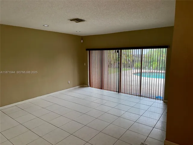 a white toilet sitting next to a shower
