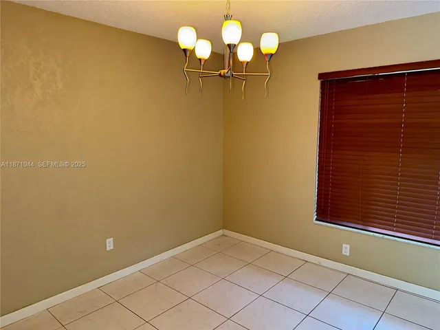 a bathroom with a granite countertop shower and a toilet