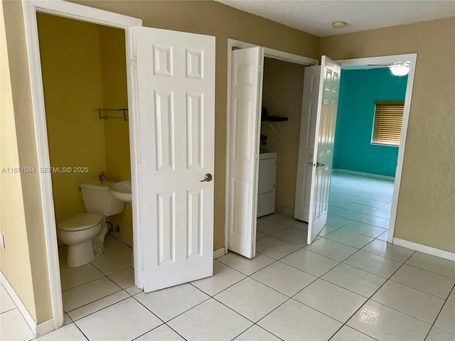 a kitchen with a refrigerator sink and microwave