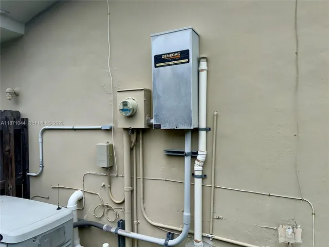 a view of a backyard with sitting area and garden