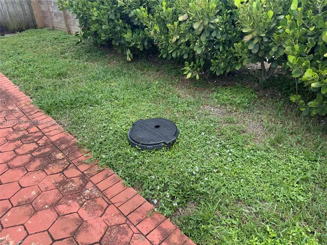 a view of a backyard with pathway