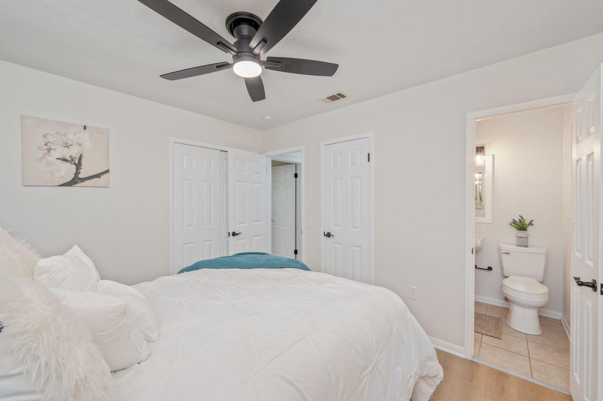 128 Salvadore Drive Crestview, FL 32536 - Photo 15 of 30 a bedroom with a bed and a view of bathroom