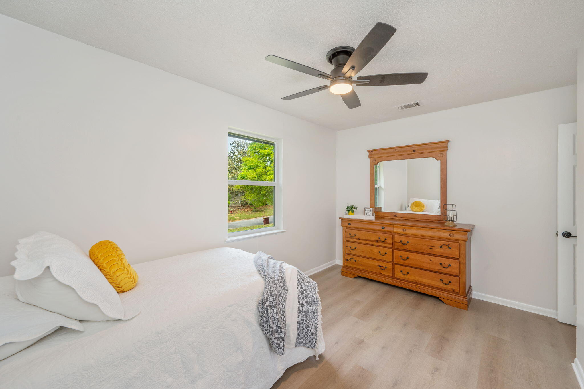 128 Salvadore Drive Crestview, FL 32536 - Photo 17 of 30 a bedroom with a bed and a window