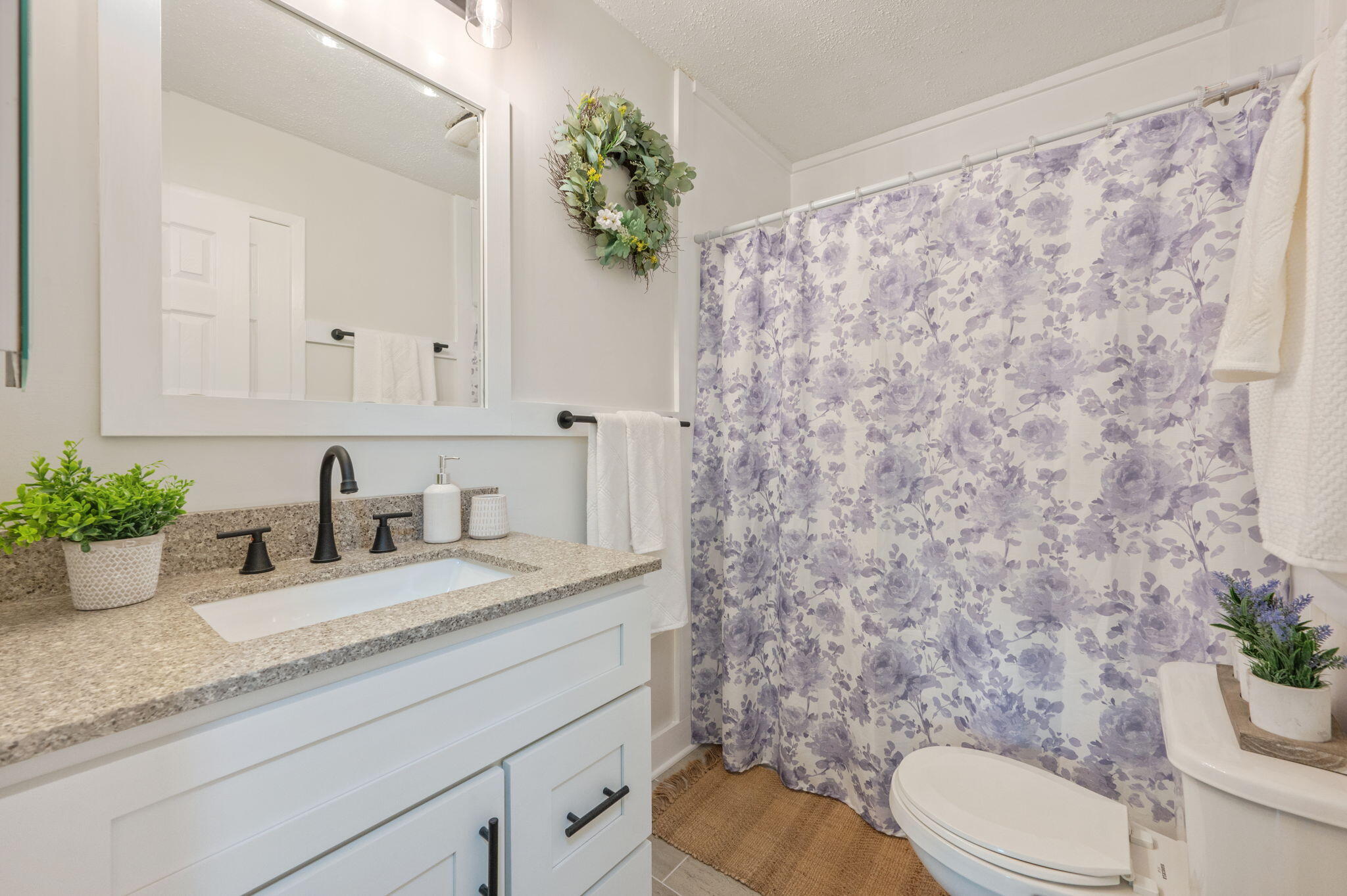 128 Salvadore Drive Crestview, FL 32536 - Photo 21 of 30 a bathroom with a granite countertop toilet sink and mirror