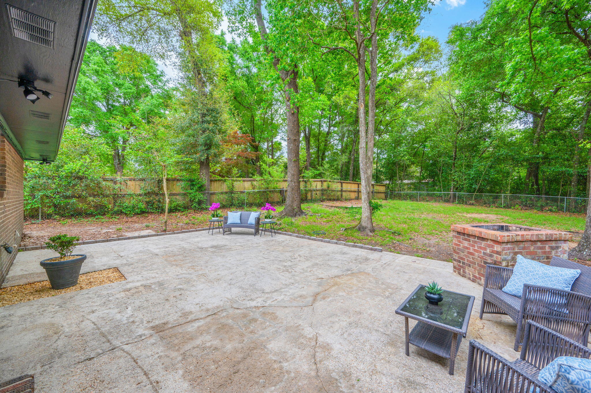 128 Salvadore Drive Crestview, FL 32536 - Photo 29 of 30 a view of a backyard with couches plants and large tree