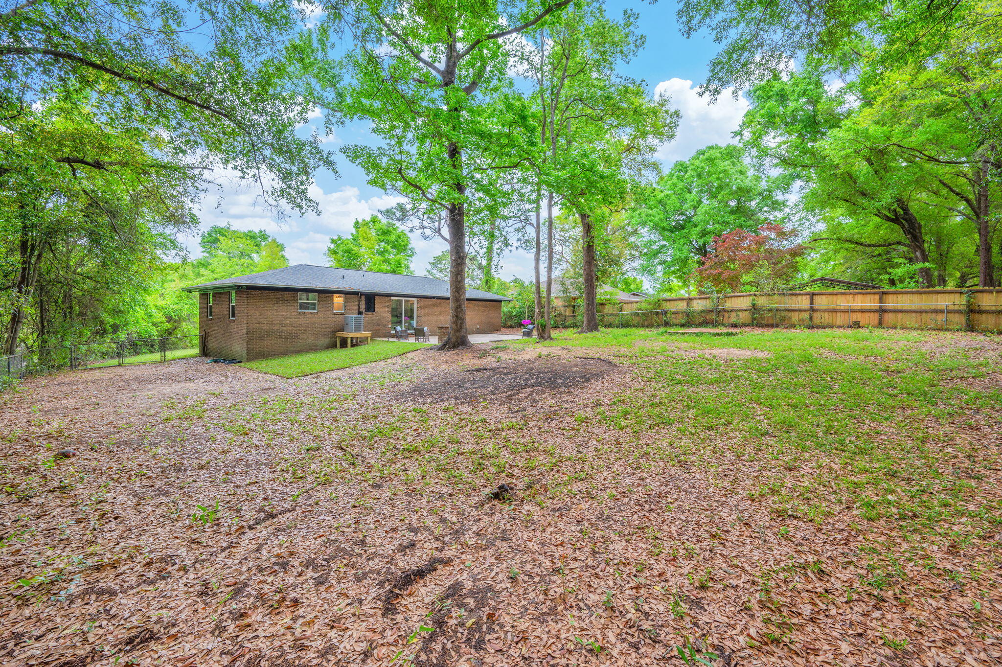128 Salvadore Drive Crestview, FL 32536 - Photo 30 of 30 a view of a backyard with a house and large trees