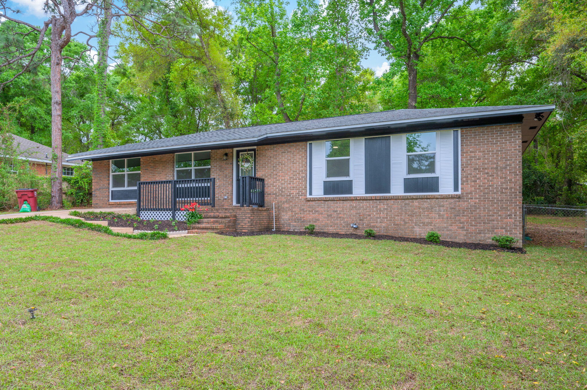 128 Salvadore Drive Crestview, FL 32536 - Photo 3 of 30 a backyard of a house with yard table and chairs