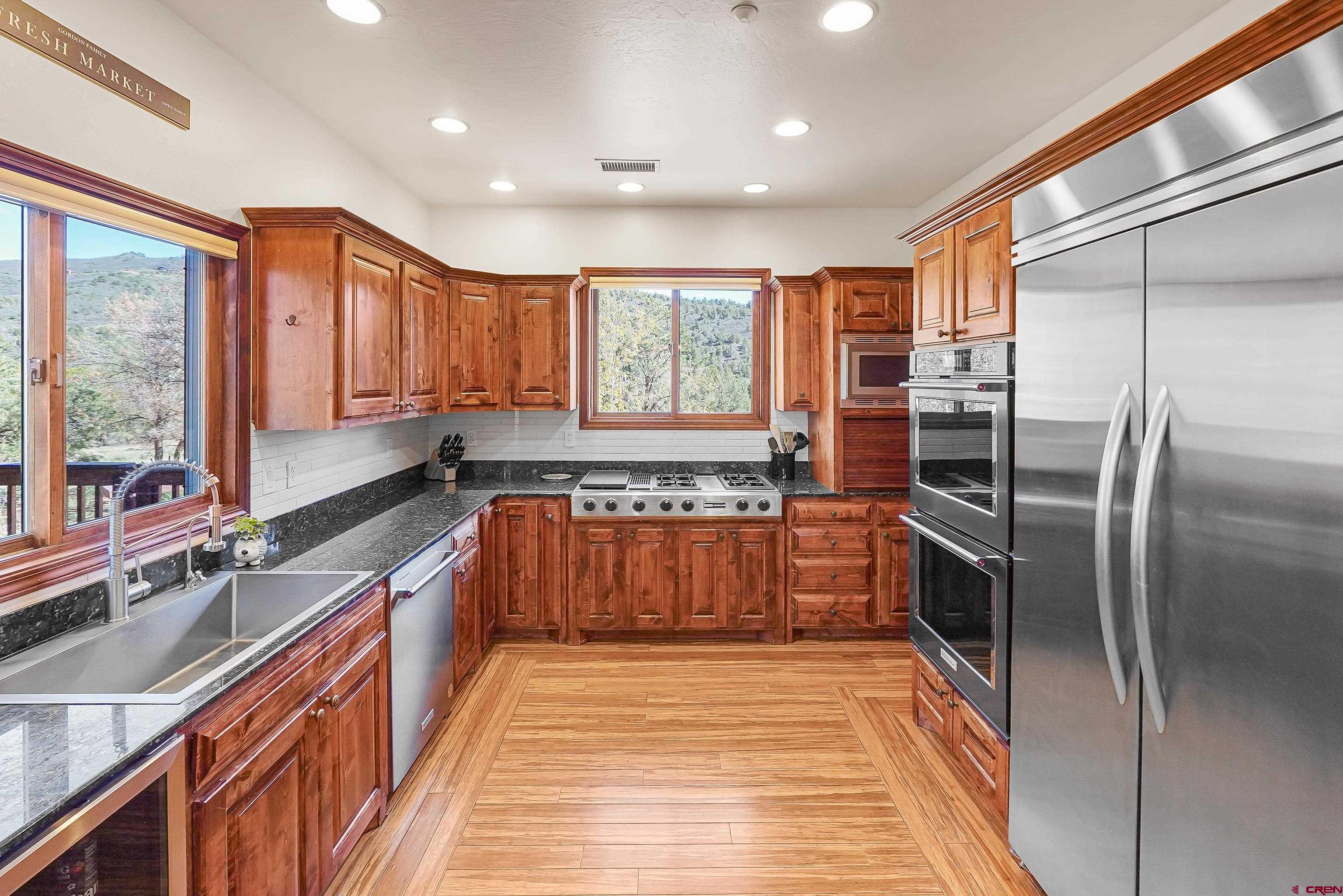 287 Wildcat Road Hesperus, CO 81326 - Photo 11 of 44 a kitchen with stainless steel appliances granite countertop a refrigerator and a sink