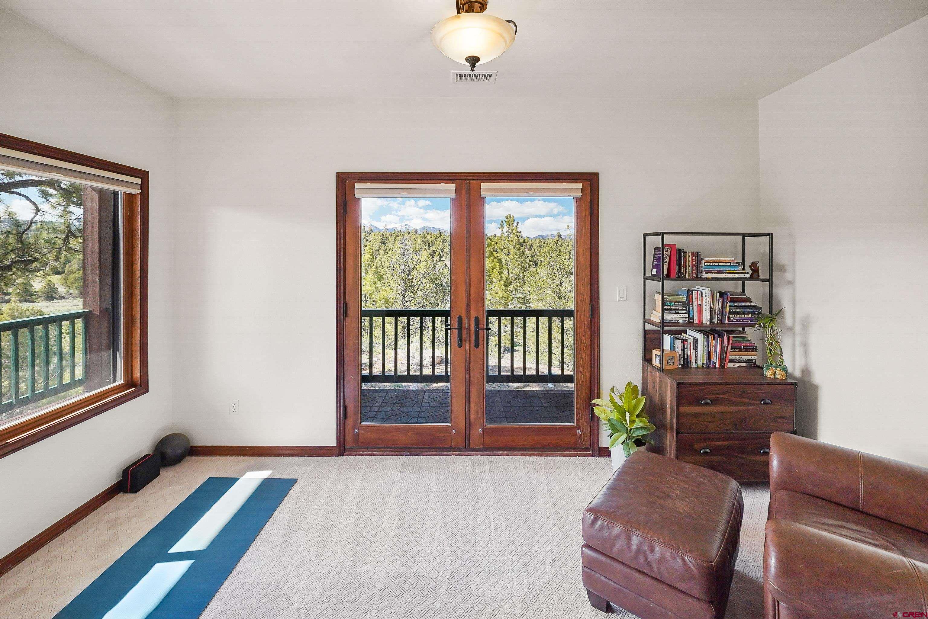 287 Wildcat Road Hesperus, CO 81326 - Photo 16 of 44 a living room with furniture and a potted plant