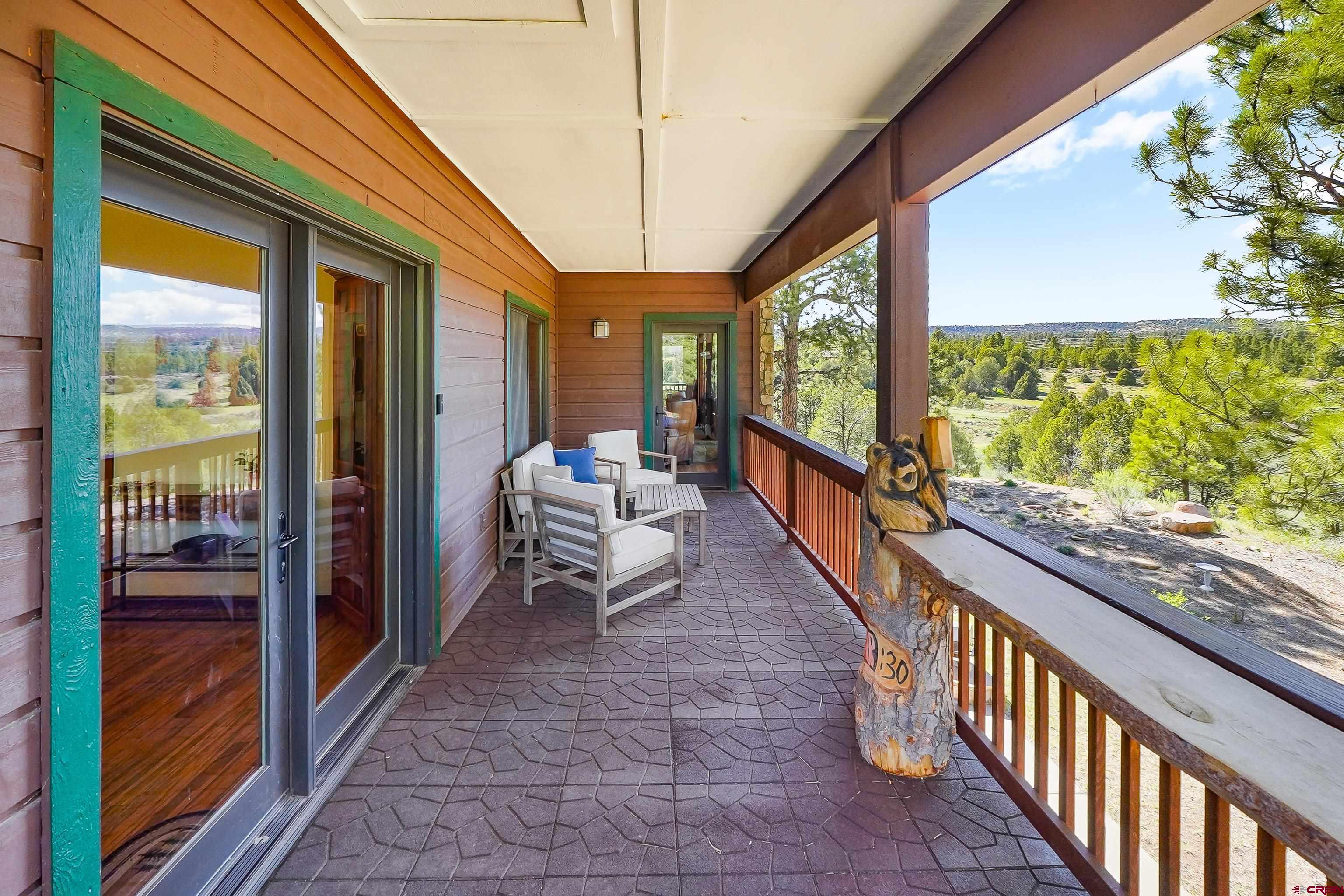 287 Wildcat Road Hesperus, CO 81326 - Photo 17 of 44 a balcony with chairs and a table