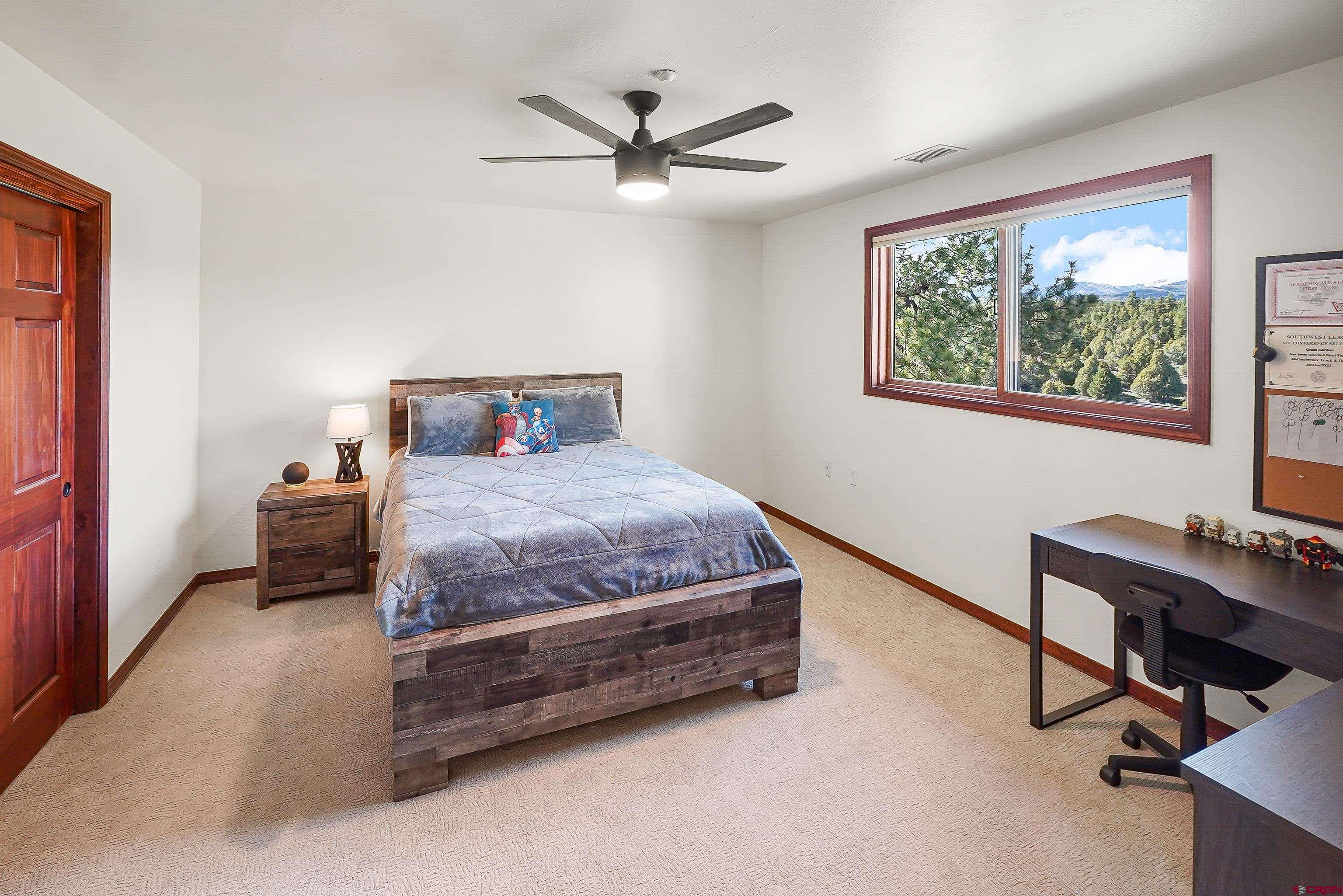 287 Wildcat Road Hesperus, CO 81326 - Photo 21 of 44 a bedroom with a bed and a window
