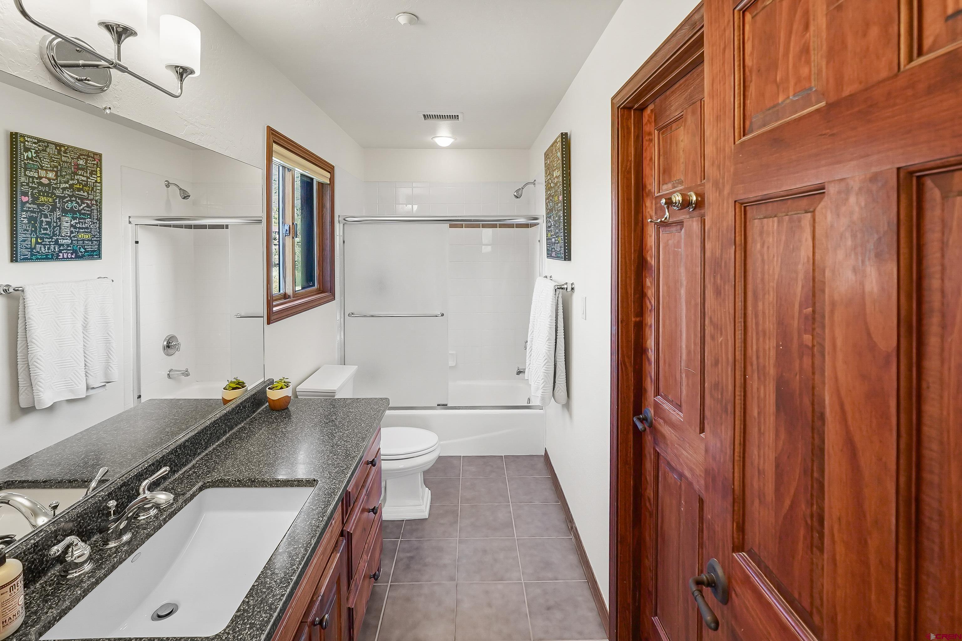 287 Wildcat Road Hesperus, CO 81326 - Photo 25 of 44 a bathroom with a sink and a mirror