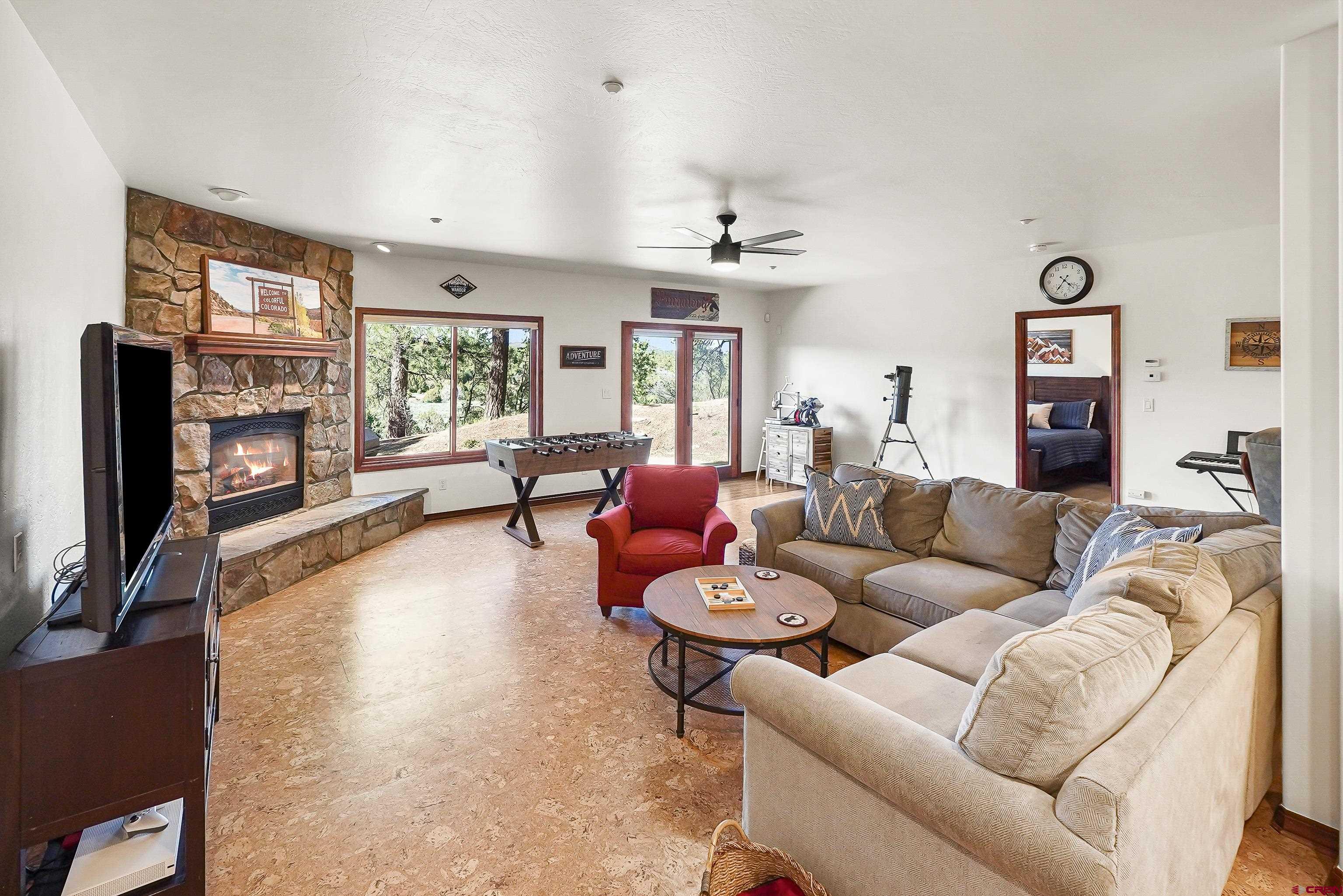 287 Wildcat Road Hesperus, CO 81326 - Photo 26 of 44 a living room with furniture and a fireplace