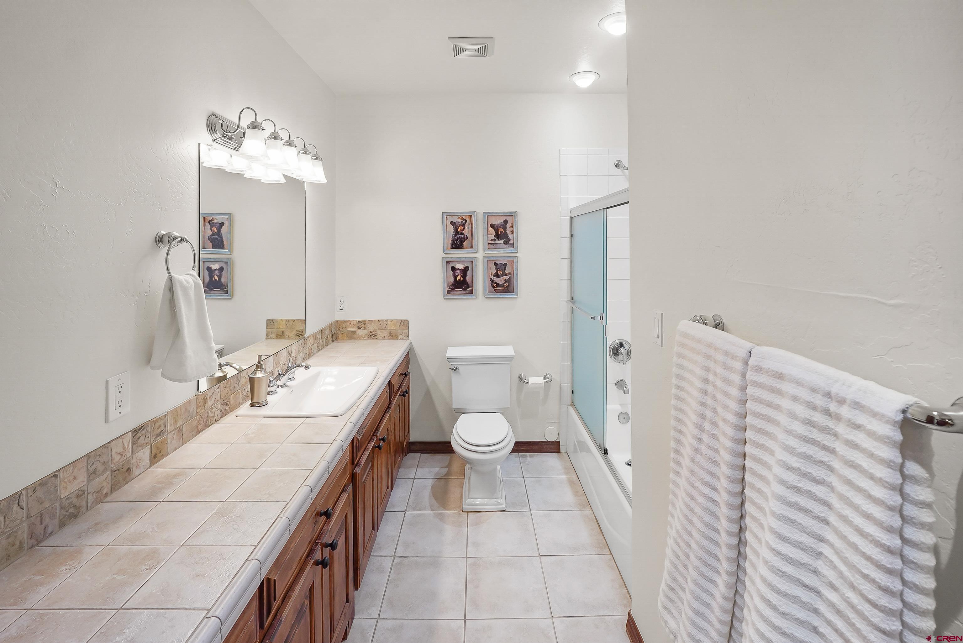 287 Wildcat Road Hesperus, CO 81326 - Photo 31 of 44 a bathroom with a double vanity sink and a toilet