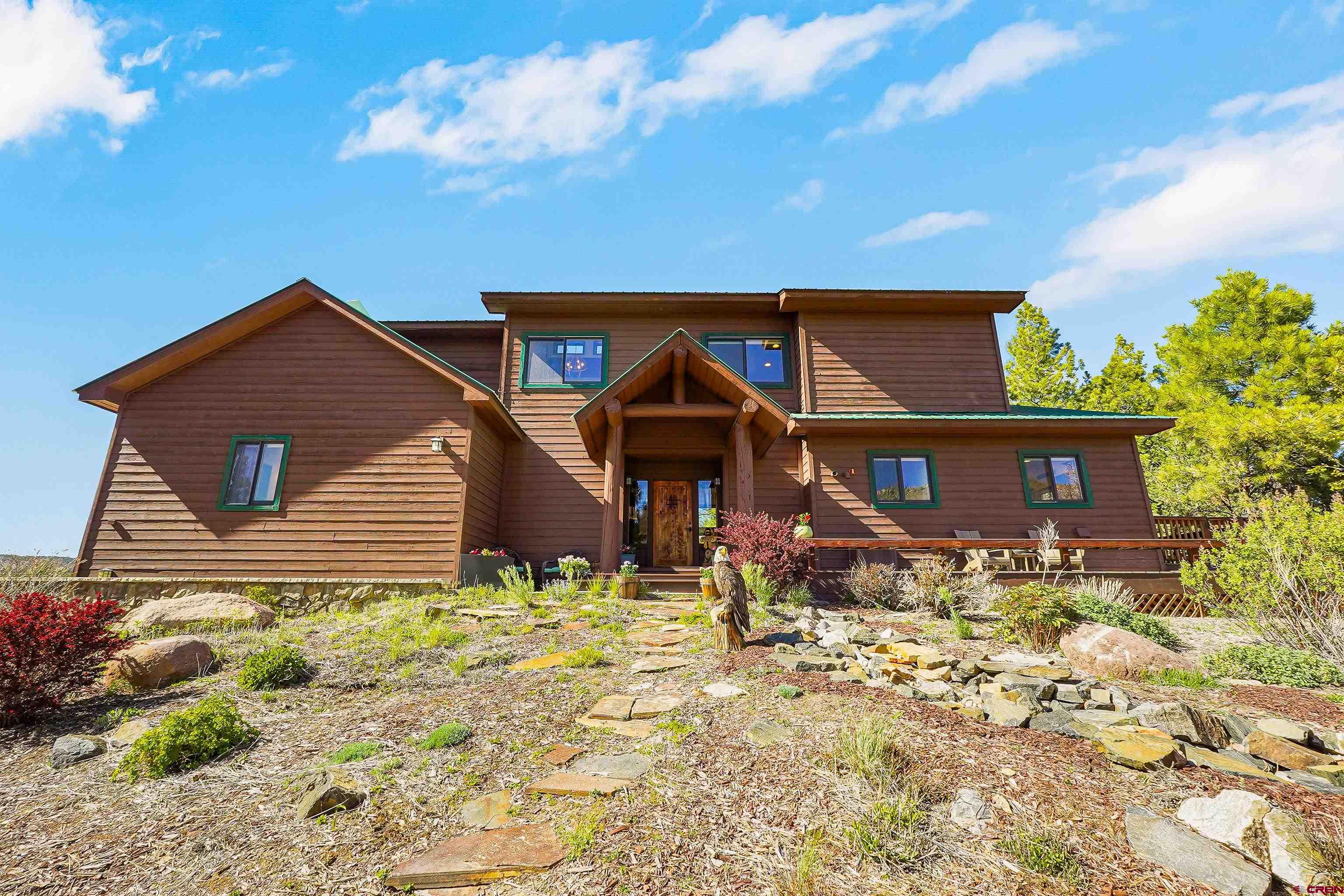 287 Wildcat Road Hesperus, CO 81326 - Photo 35 of 44 a front view of a house with a yard