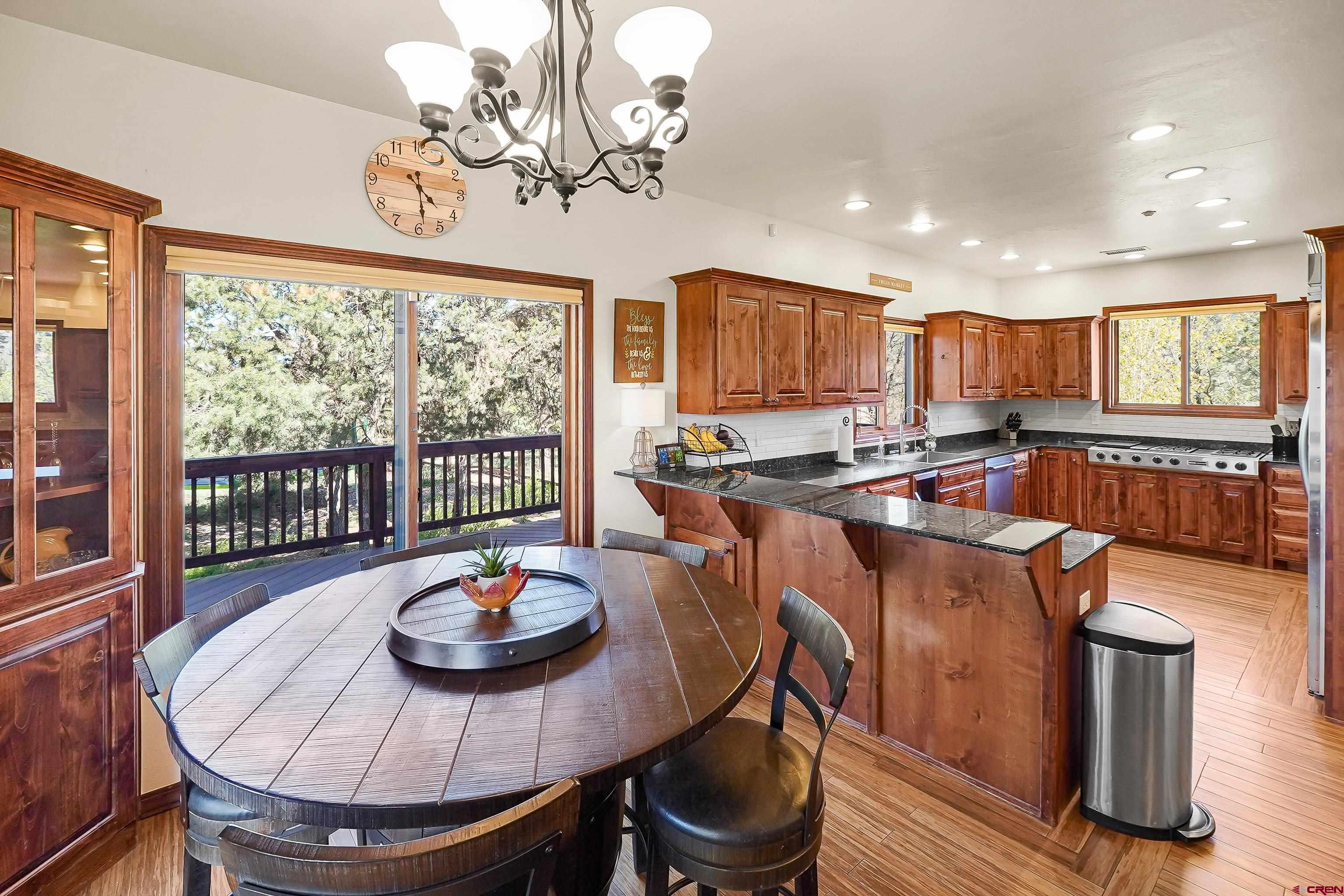 287 Wildcat Road Hesperus, CO 81326 - Photo 4 of 44 a kitchen with sink a stove and chairs