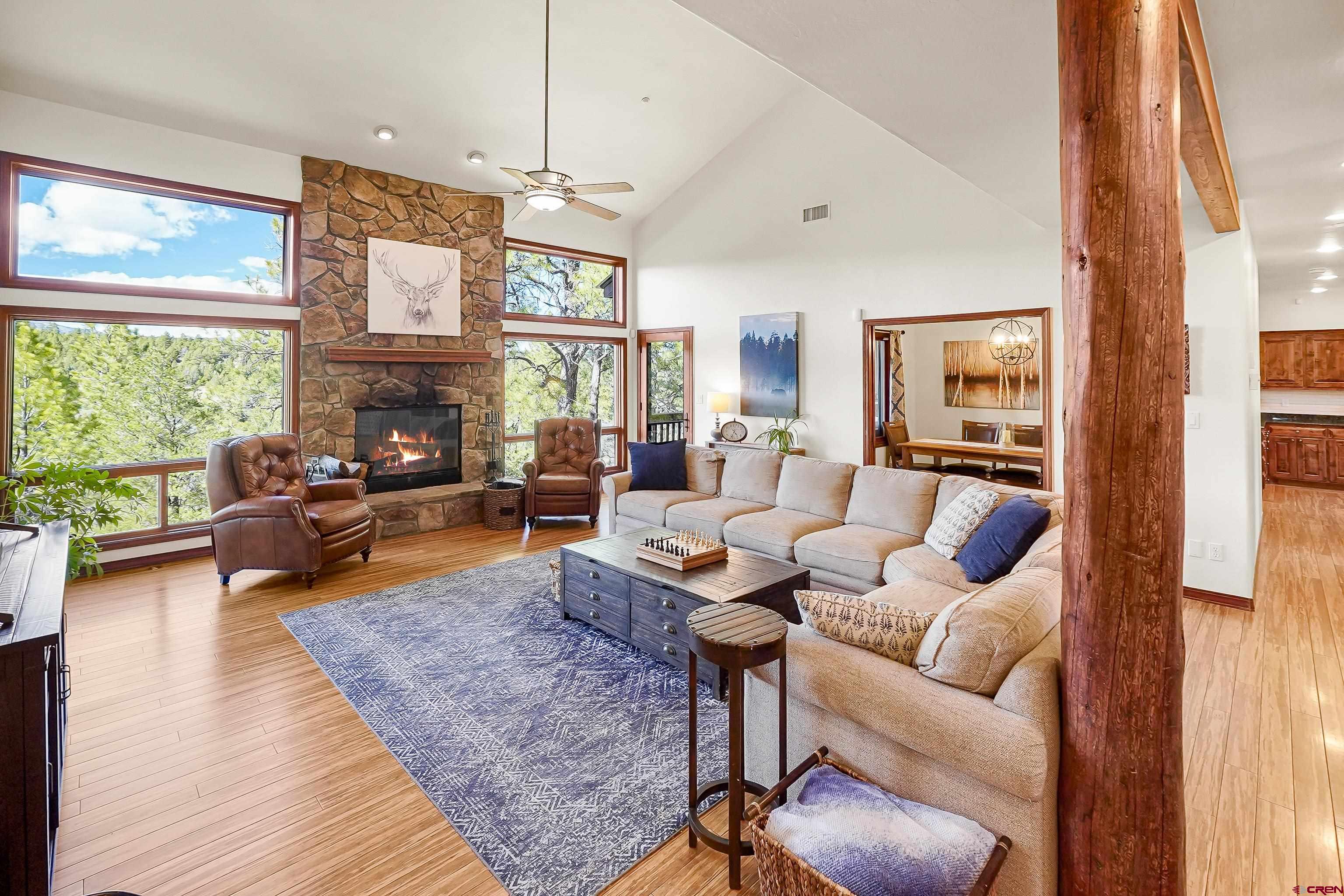 287 Wildcat Road Hesperus, CO 81326 - Photo 7 of 44 a living room with furniture fireplace and a large window