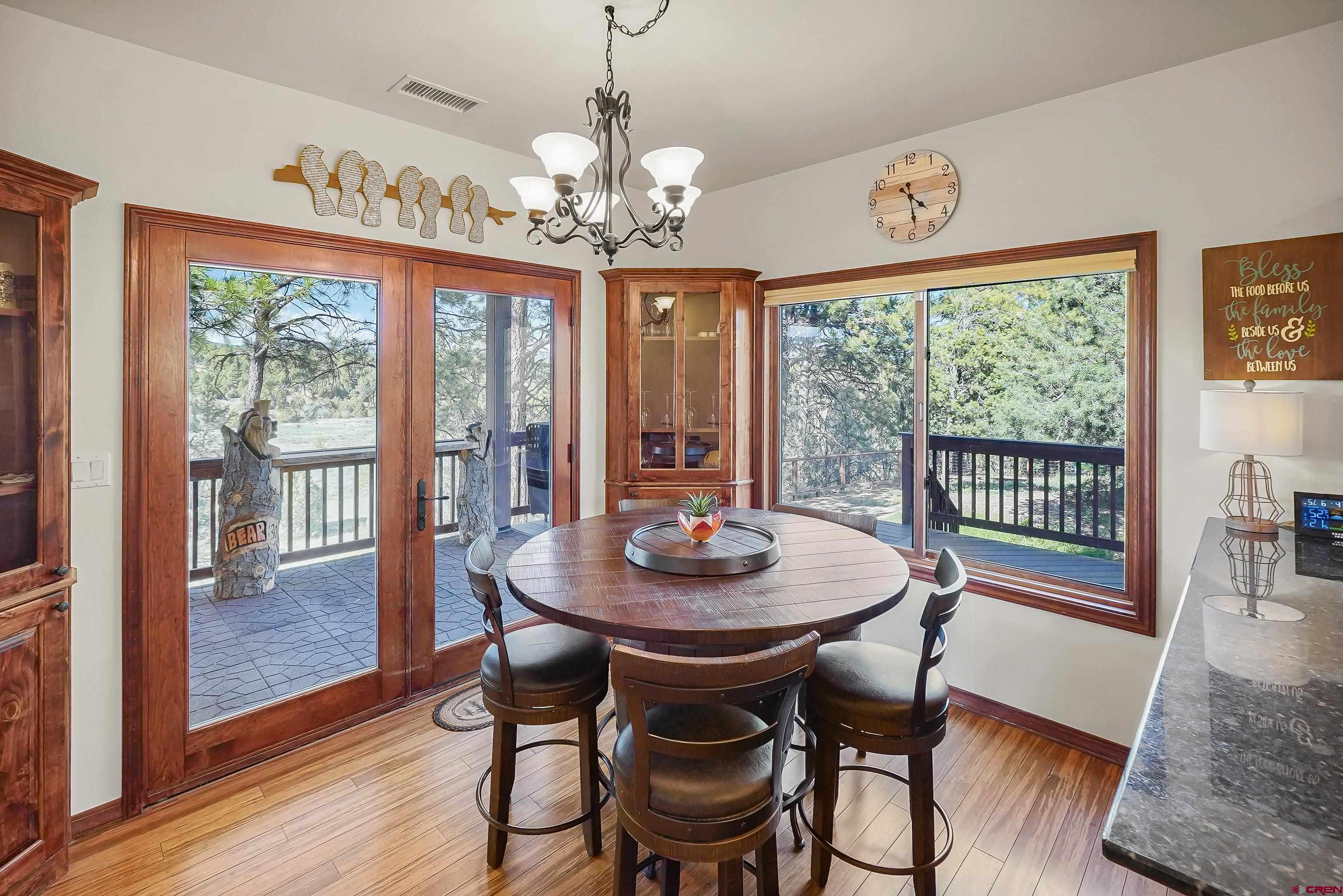 287 Wildcat Road Hesperus, CO 81326 - Photo 10 of 44 a view of a dining room with furniture wooden floor and chandelier