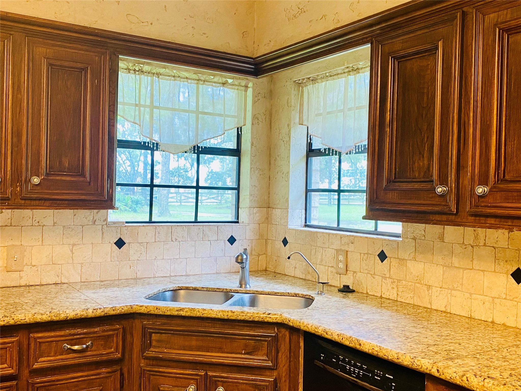 14212 Horseshoe Bend Conroe, TX 77384 - Photo 13 of 45 a kitchen with a sink and a window