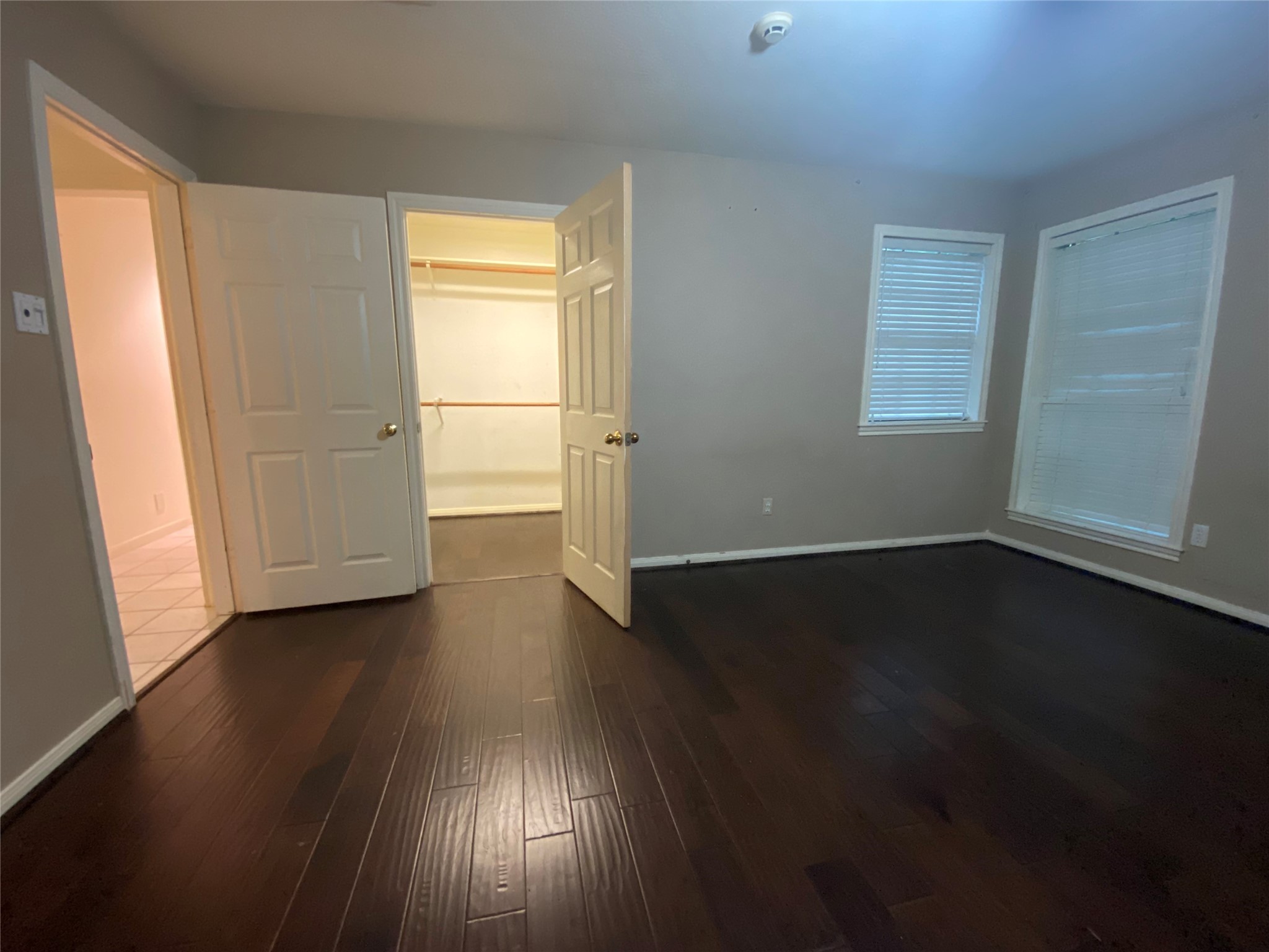 14212 Horseshoe Bend Conroe, TX 77384 - Photo 32 of 45 a view of an empty room with wooden floor and a window