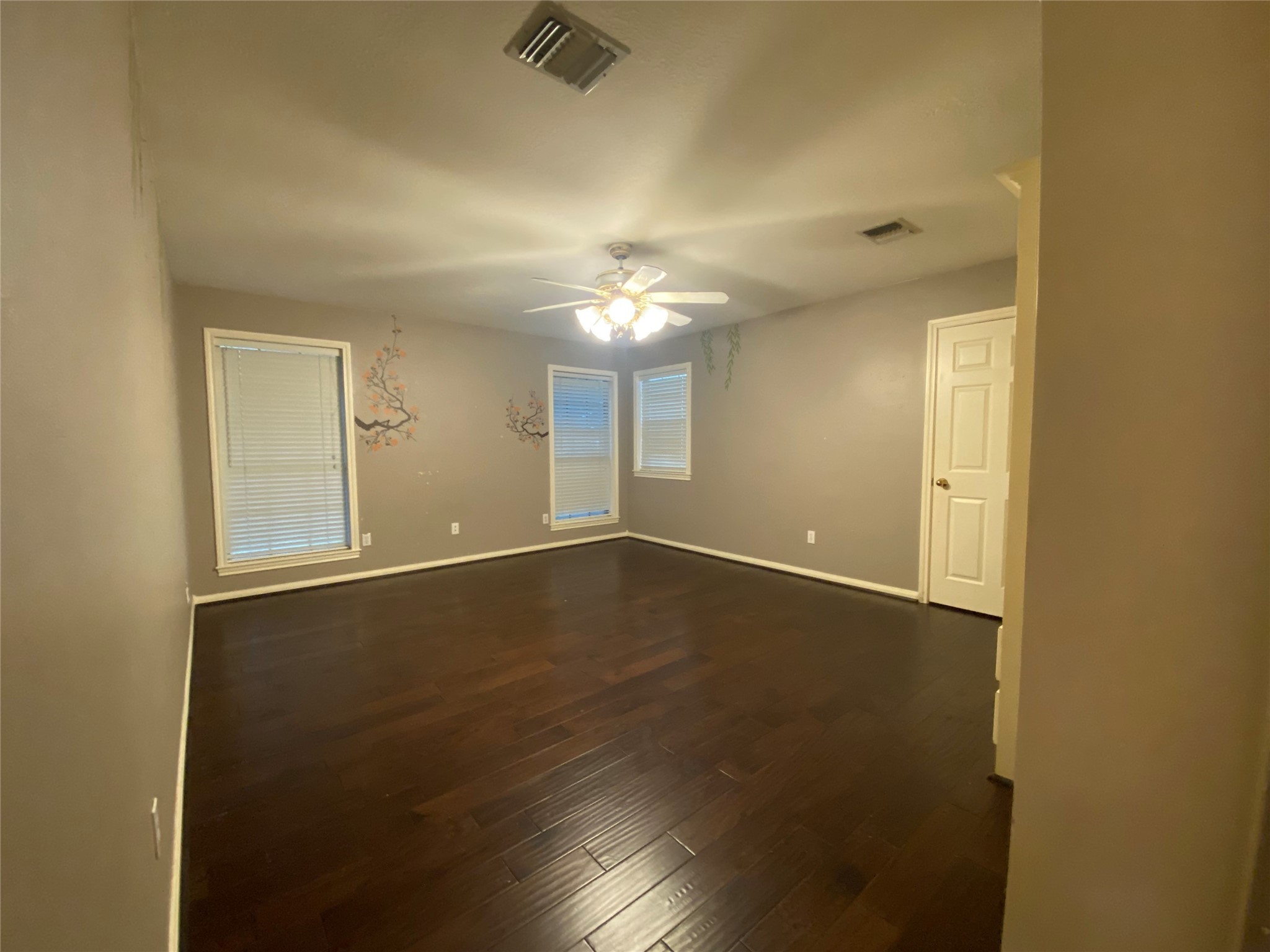 14212 Horseshoe Bend Conroe, TX 77384 - Photo 33 of 45 an empty room with wooden floor and windows