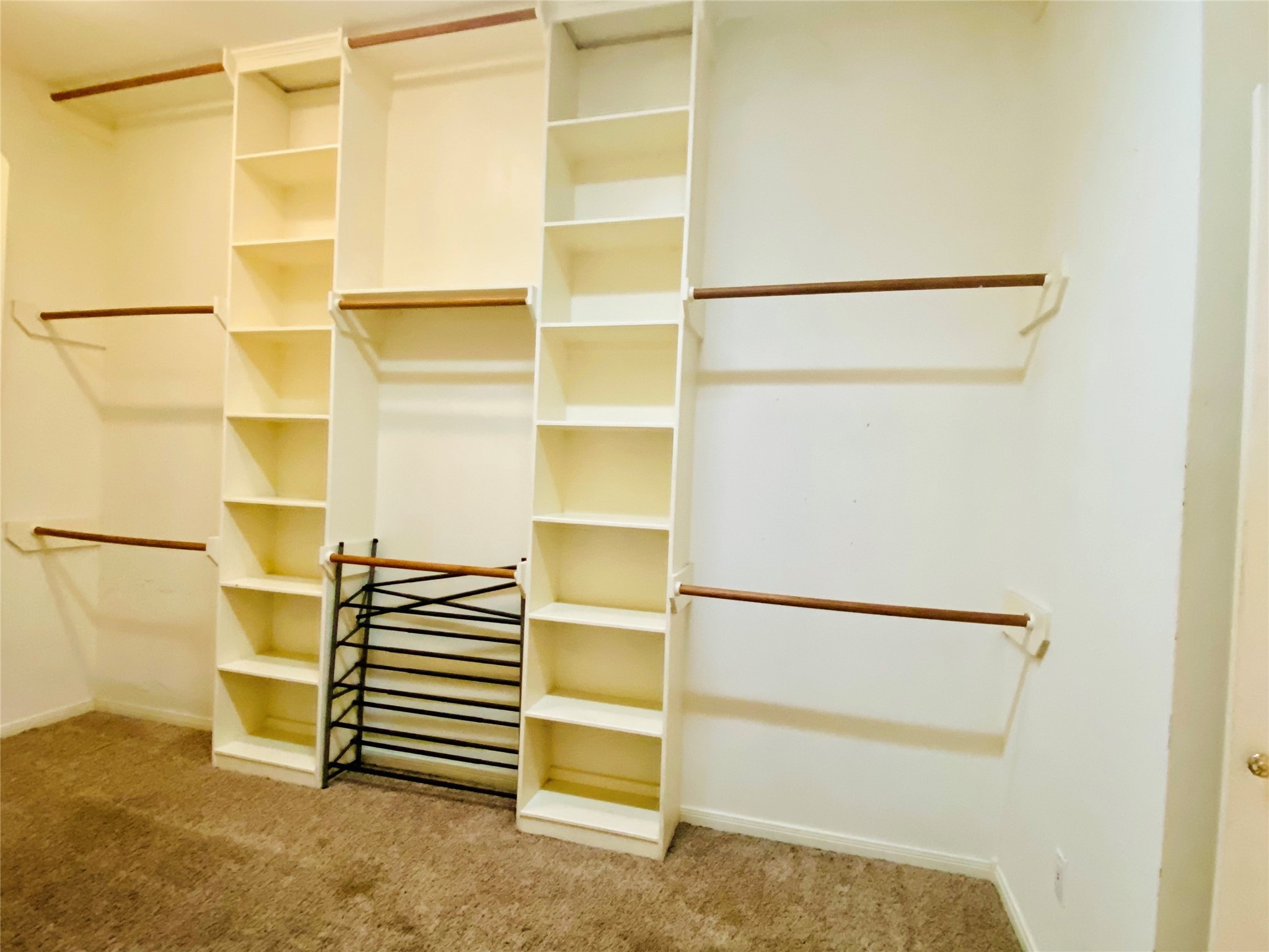 14212 Horseshoe Bend Conroe, TX 77384 - Photo 45 of 45 a view of walk in closet with empty racks