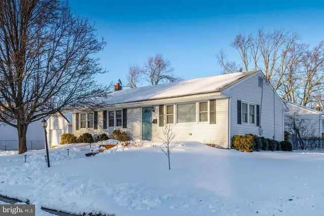 a front view of a house with basket ball court and furniture