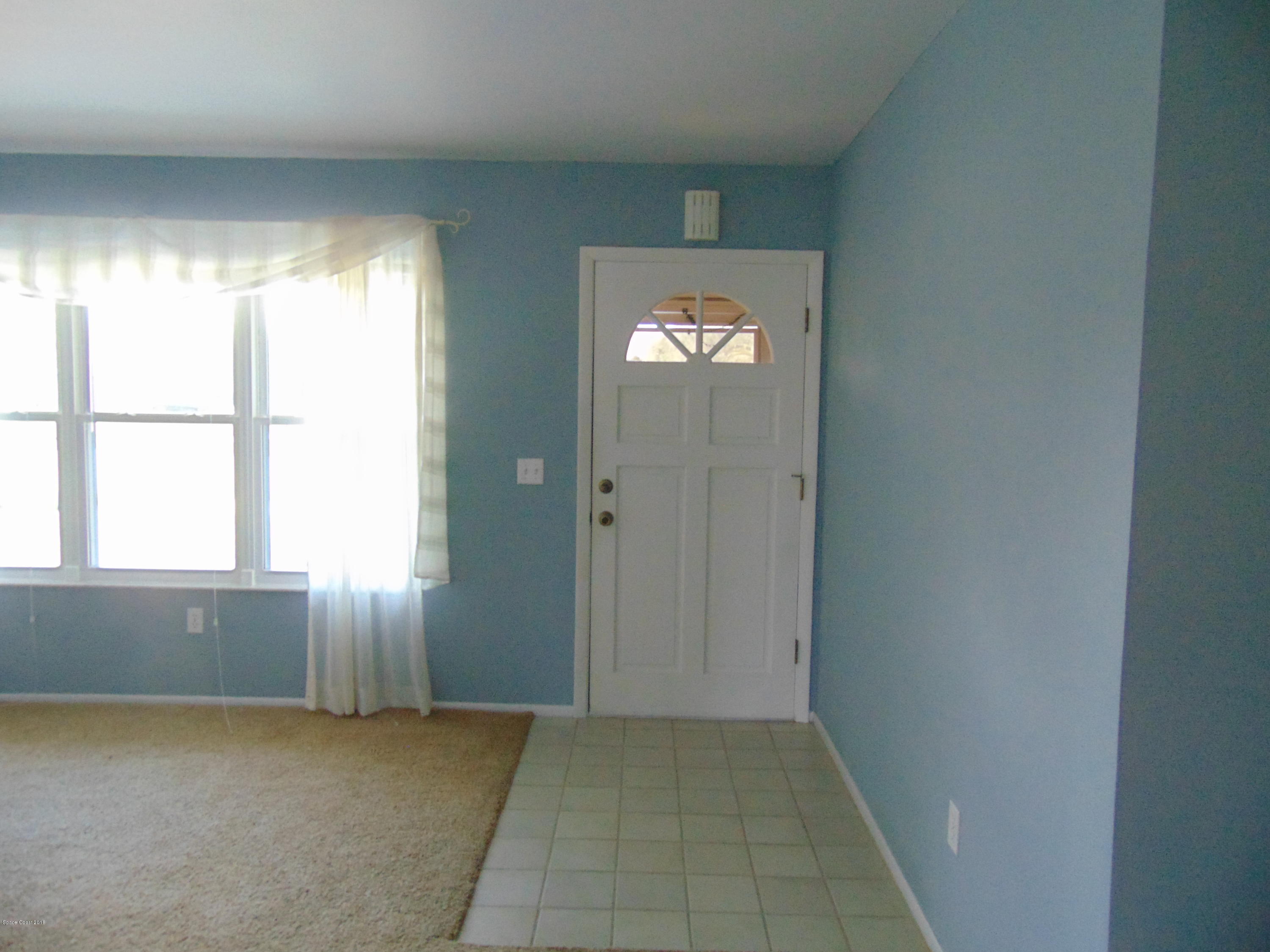 1083 Cromey Road Northeast Palm Bay, FL 32905 - Photo 2 of 39 Front Entrance