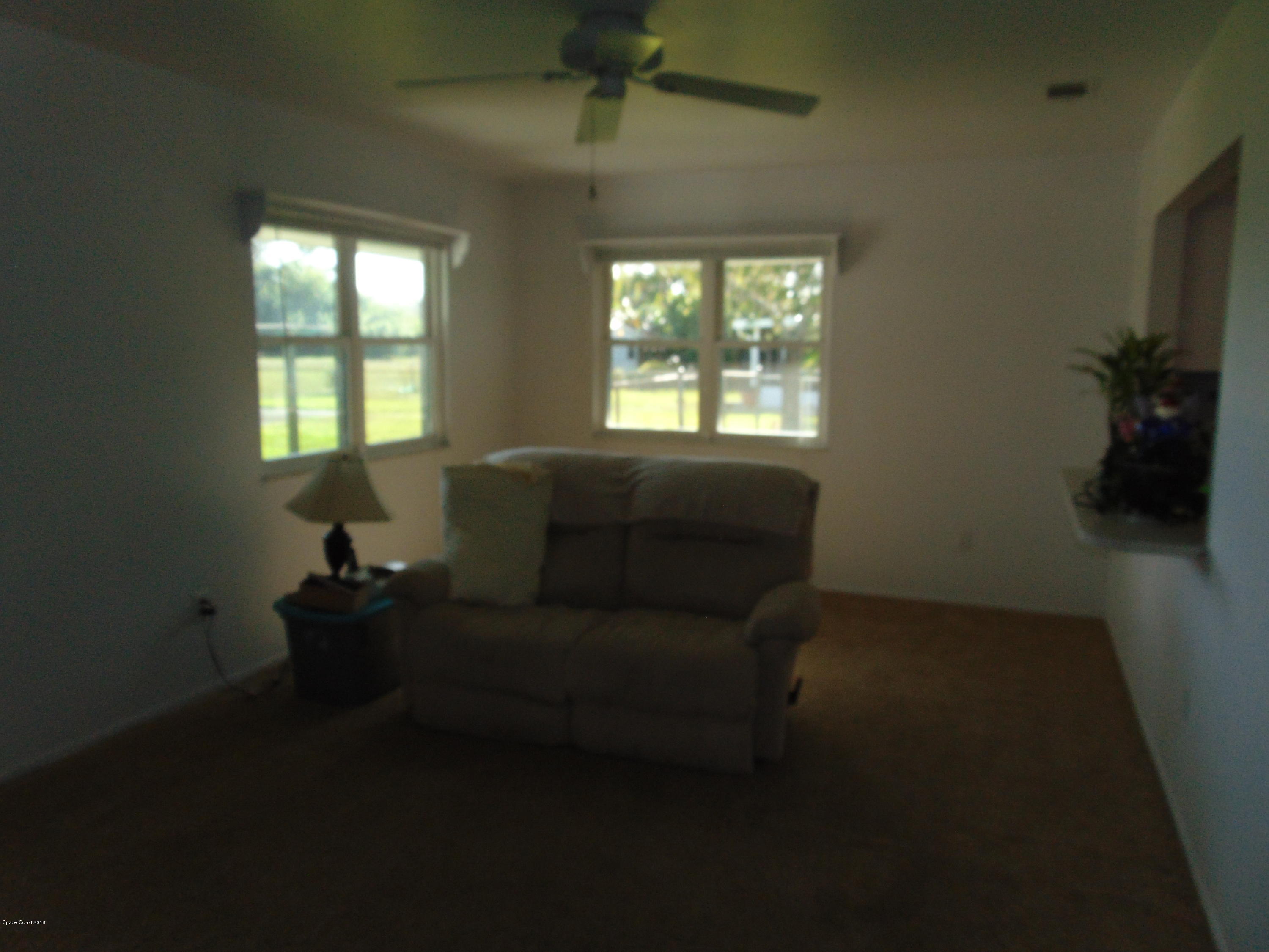 1083 Cromey Road Northeast Palm Bay, FL 32905 - Photo 11 of 39 Family Room 1
