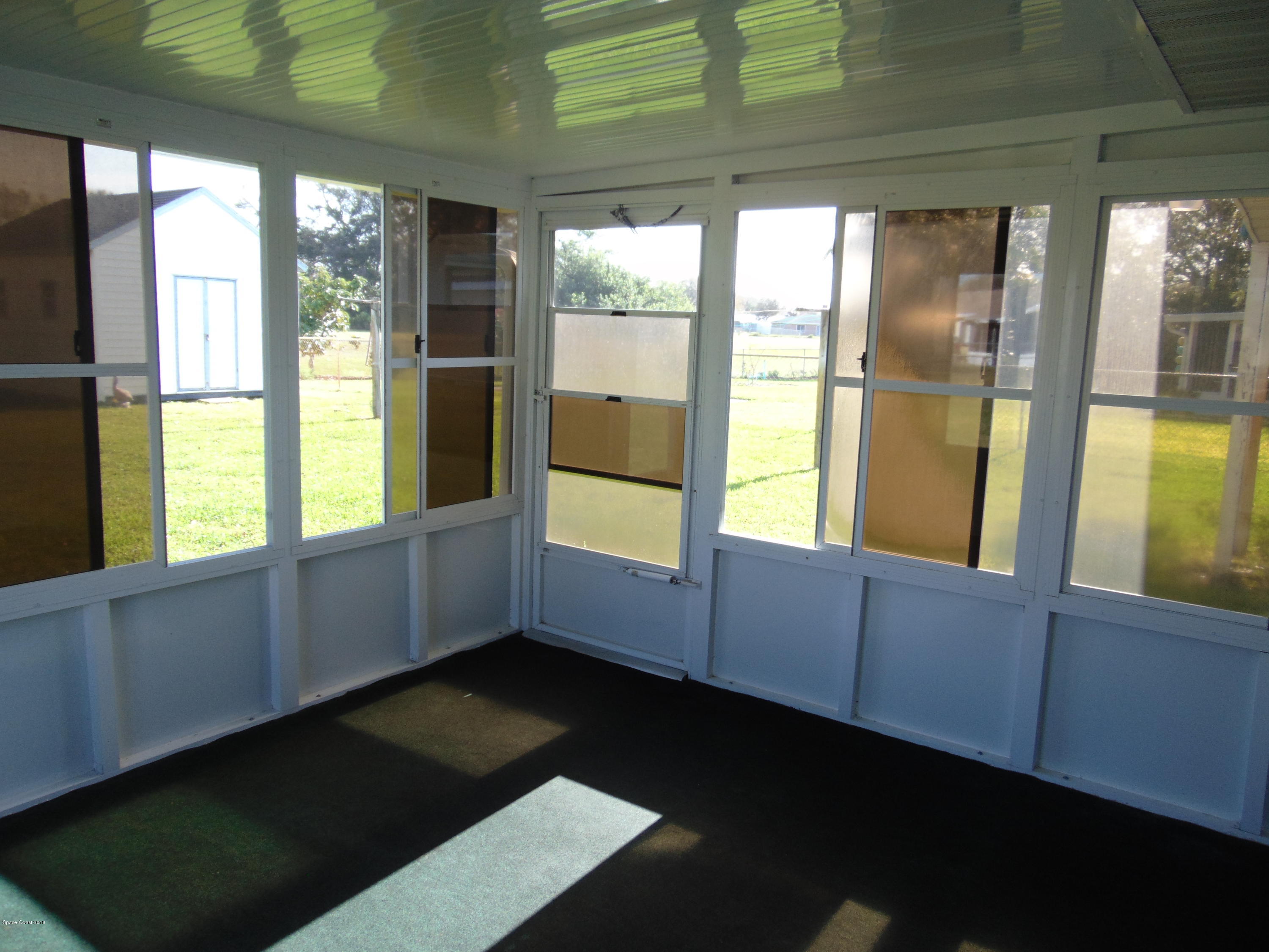 1083 Cromey Road Northeast Palm Bay, FL 32905 - Photo 13 of 39 All Season Porch