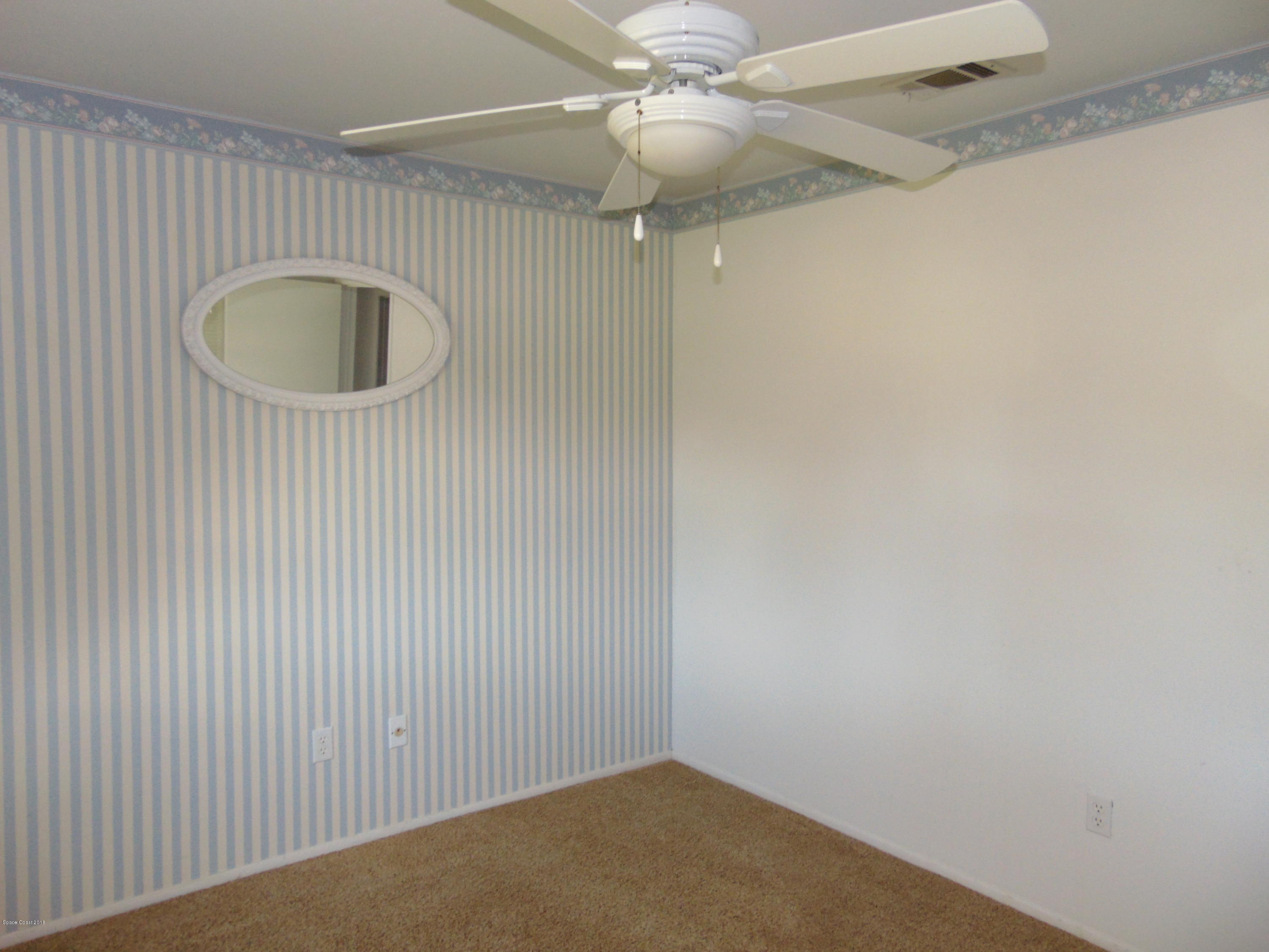 1083 Cromey Road Northeast Palm Bay, FL 32905 - Photo 23 of 39 Bedroom 3