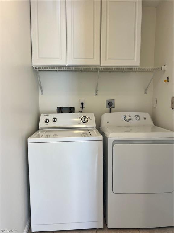 7791 Esmeralda Way, Unit L203 Naples, FL 34109 - Photo 12 of 23 a utility room with dryer and washer