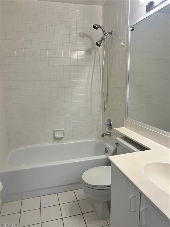 7791 Esmeralda Way, Unit L203 Naples, FL 34109 - Photo 13 of 23 a bathroom with a sink a toilet and a bathtub