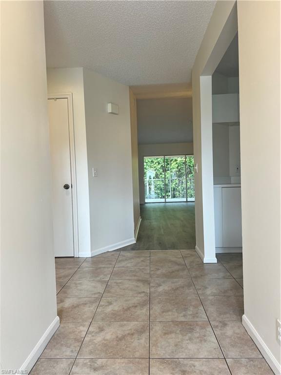 7791 Esmeralda Way, Unit L203 Naples, FL 34109 - Photo 2 of 23 a view of entryway with window