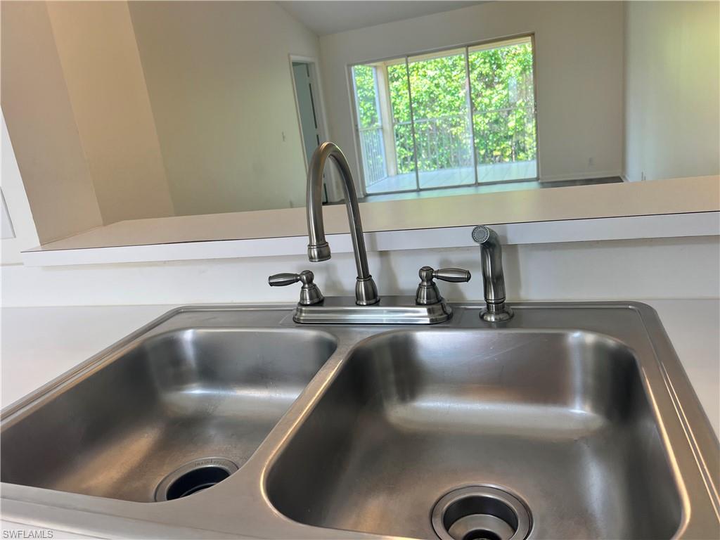 7791 Esmeralda Way, Unit L203 Naples, FL 34109 - Photo 6 of 23 a close view of sink