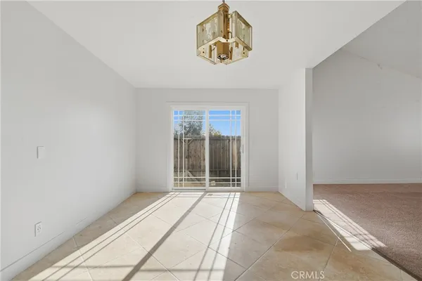 a view of empty room with furniture and fireplace