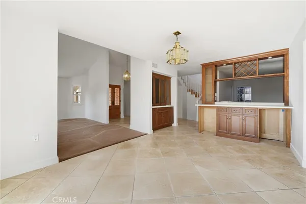 a view of an empty room with a fireplace