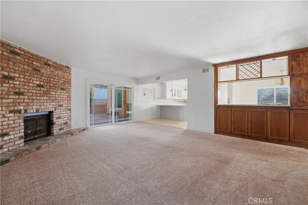 a kitchen with stainless steel appliances granite countertop a stove and a refrigerator