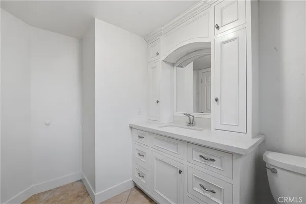 a bathroom with a granite countertop sink a mirror and a