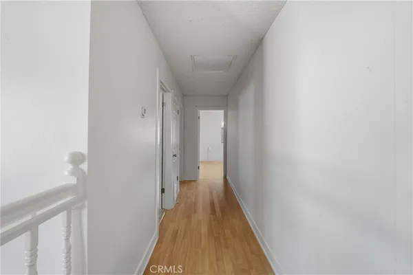 a spacious bathroom with a double vanity sink a toilet and a mirror