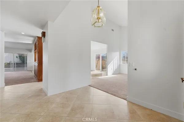 an empty room with a windows and closet
