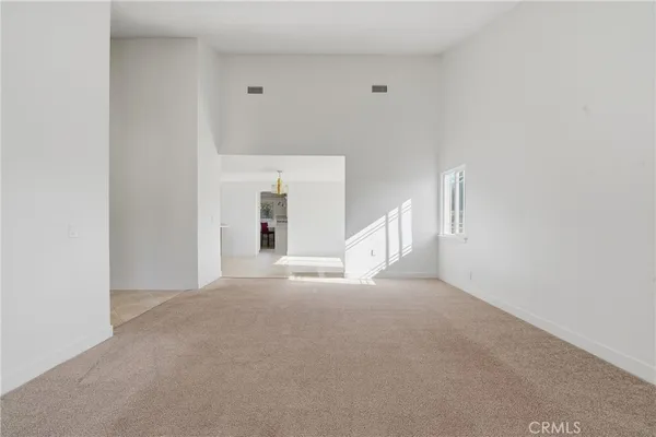 an empty room with furniture and a fireplace