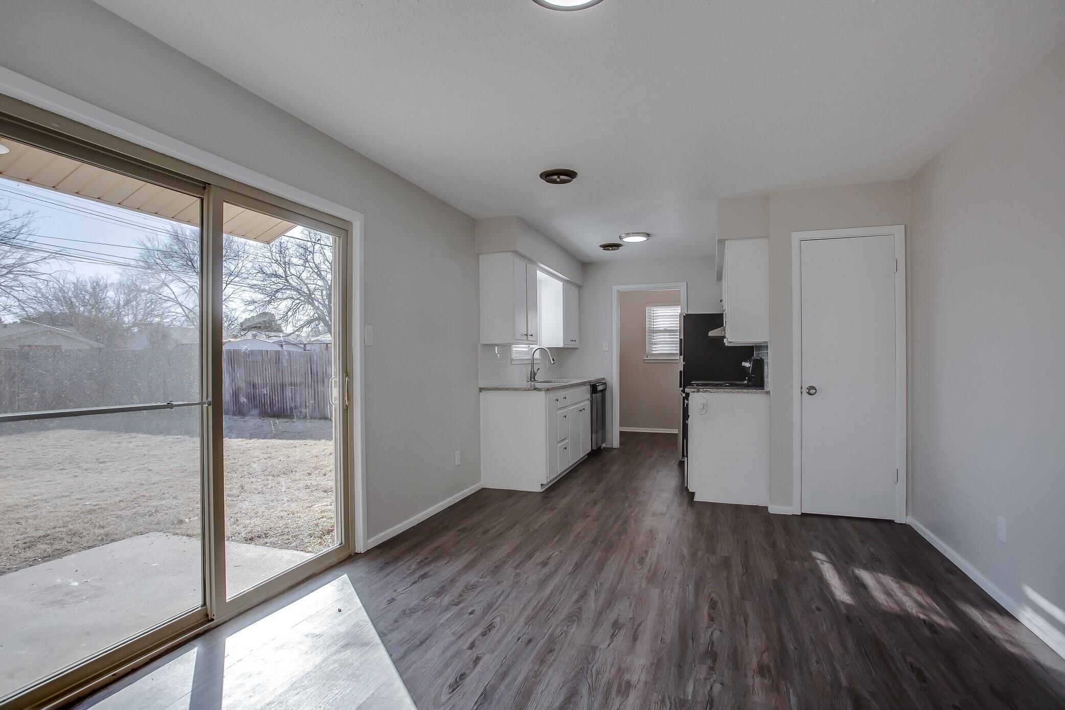 5419 46th Street Lubbock, TX 79414 - Photo 4 of 14 a view of kitchen with wooden floor
