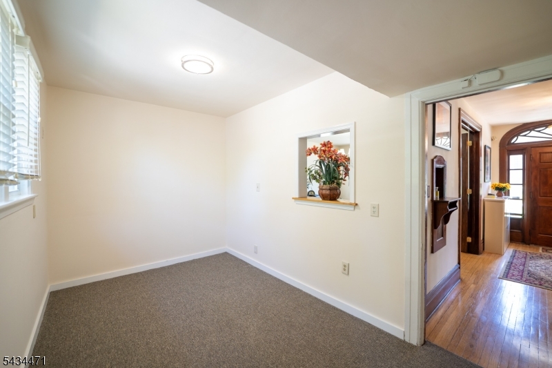 192 Lincoln Road Phillipsburg, NJ 08865 - Photo 27 of 50 a view of a hallway with wooden floor and a living room