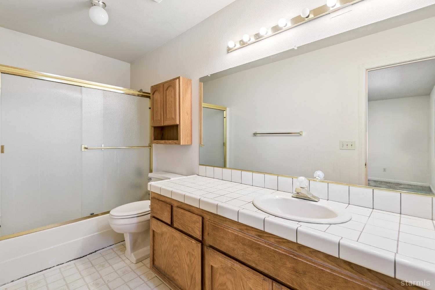 2699 Elwood Avenue South Lake Tahoe, CA 96150 - Photo 13 of 27 a bathroom with a sink a toilet and shower